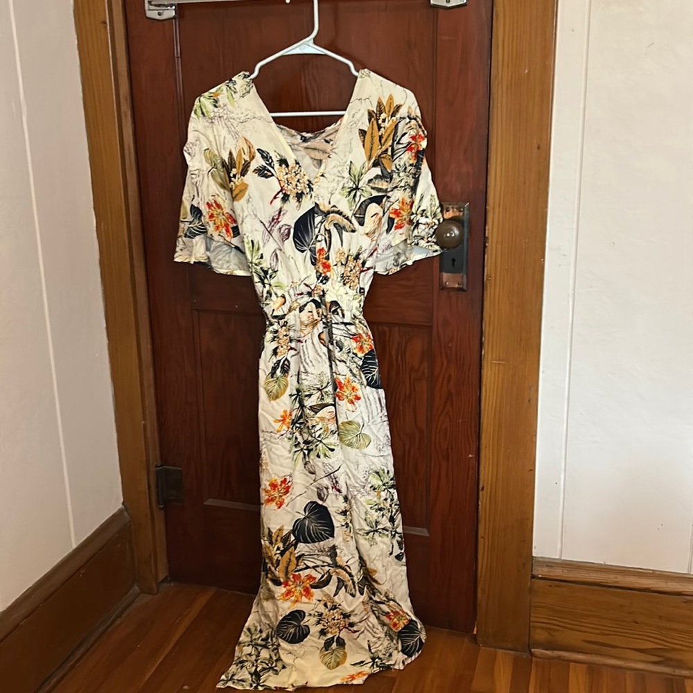 Floral dress size medium but runs a little big in my opinion.